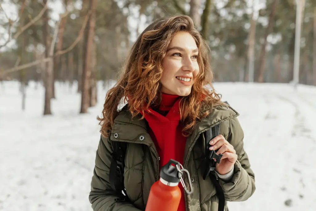 medium-shot-smiley-woman-snow.jpg